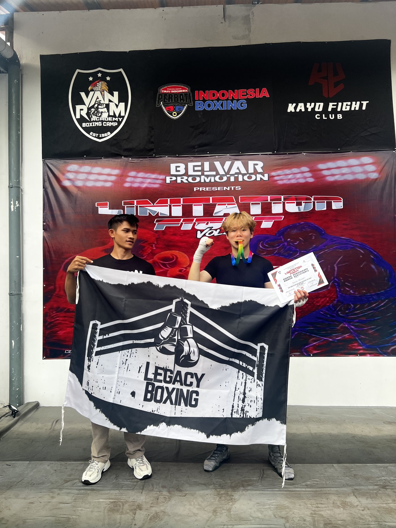 Legacy Boxing fighter with the flag and medal after a win