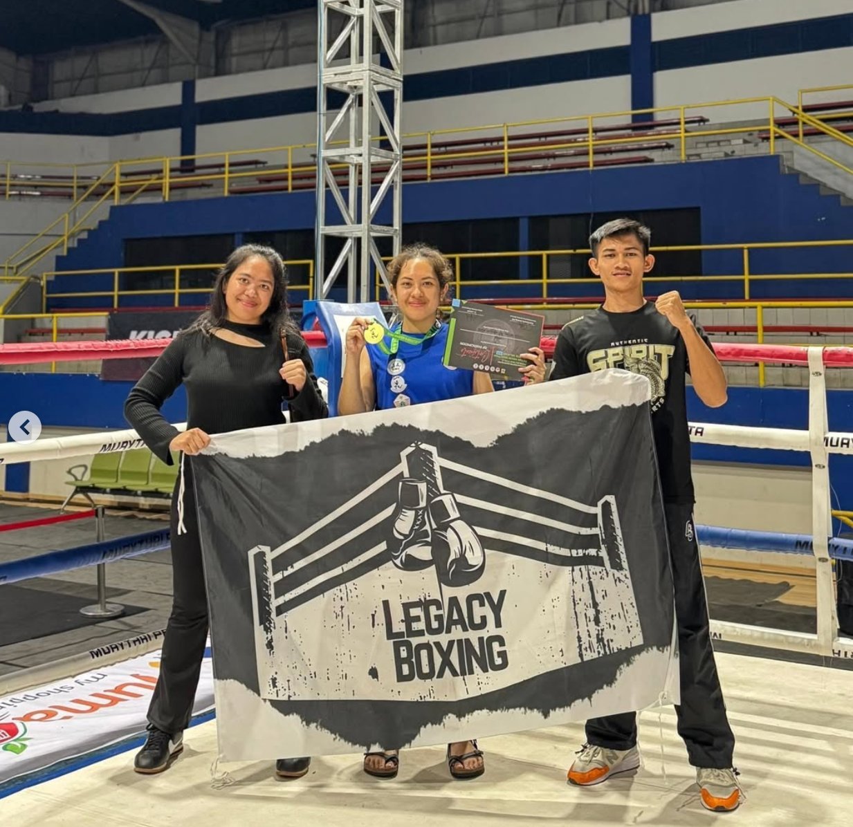 Legacy Boxing member with medal and certificate after winning